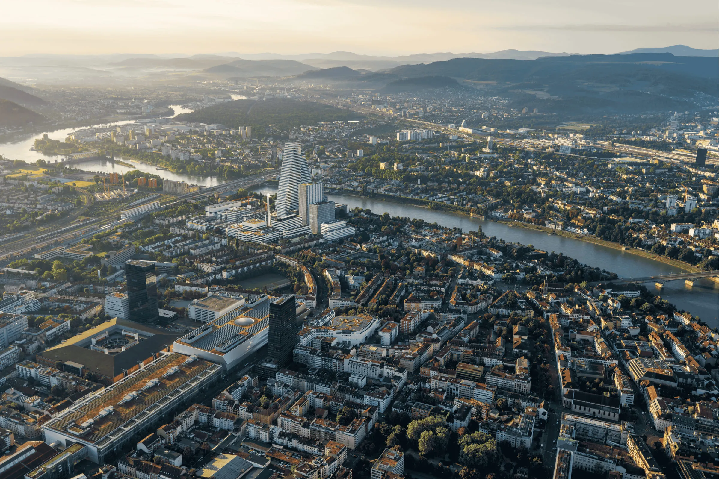Basel from the air at daybreak, the Rhine running through the city.